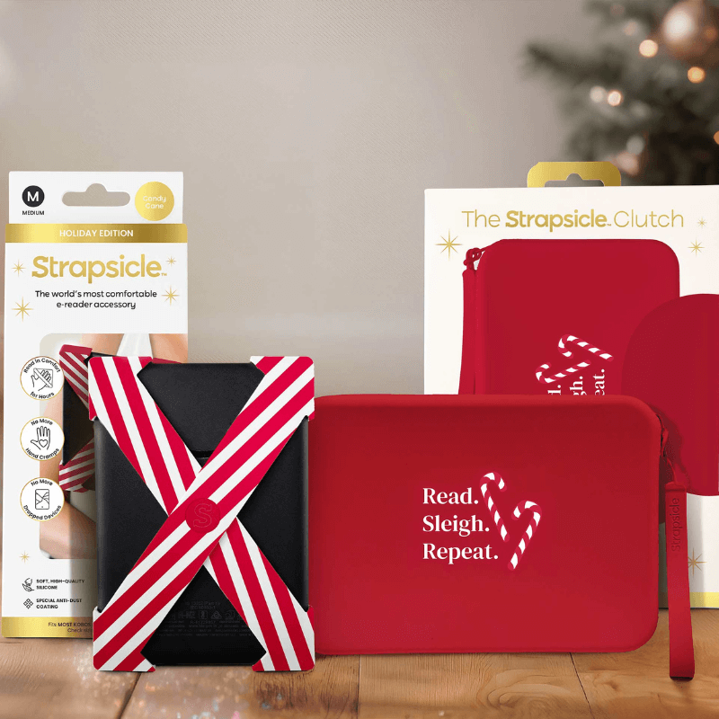 A candy cane straps and clutch with packaging on a wooden surface with blurred lights in the background