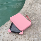 Blush Clutch Bag with handle for handheld device and two blush matching straps.
