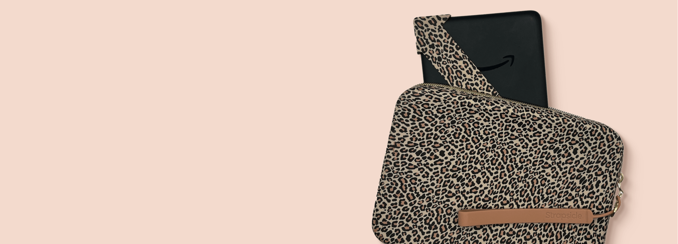 Leopard print crossbody bag with a phone on a beige background