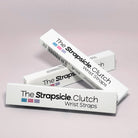 Boxes of 'The Strapsicle Clutch Wrist Straps' on a light pink background