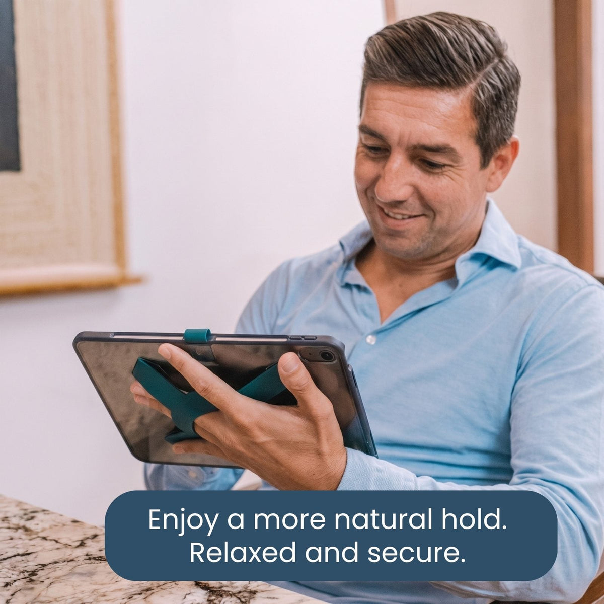 Man holding an iPad with a relaxed hold all-groups