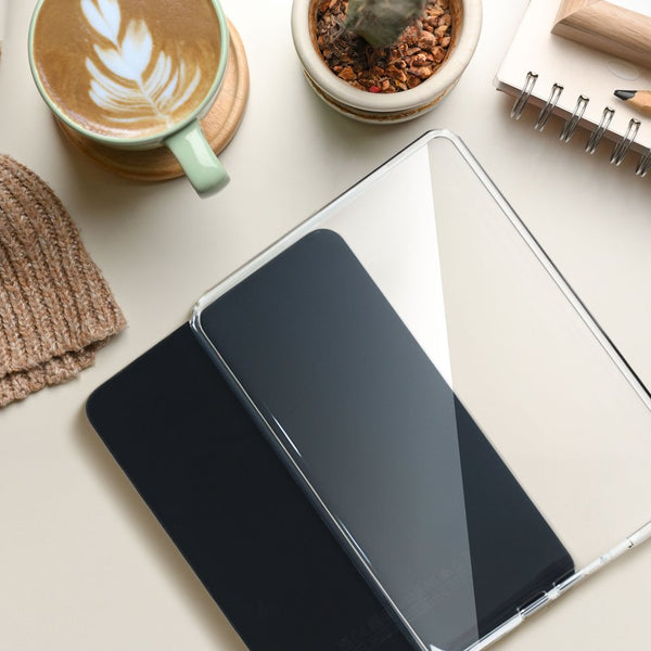 Strapsicle clear case on a cosy desk with a latte and notebook